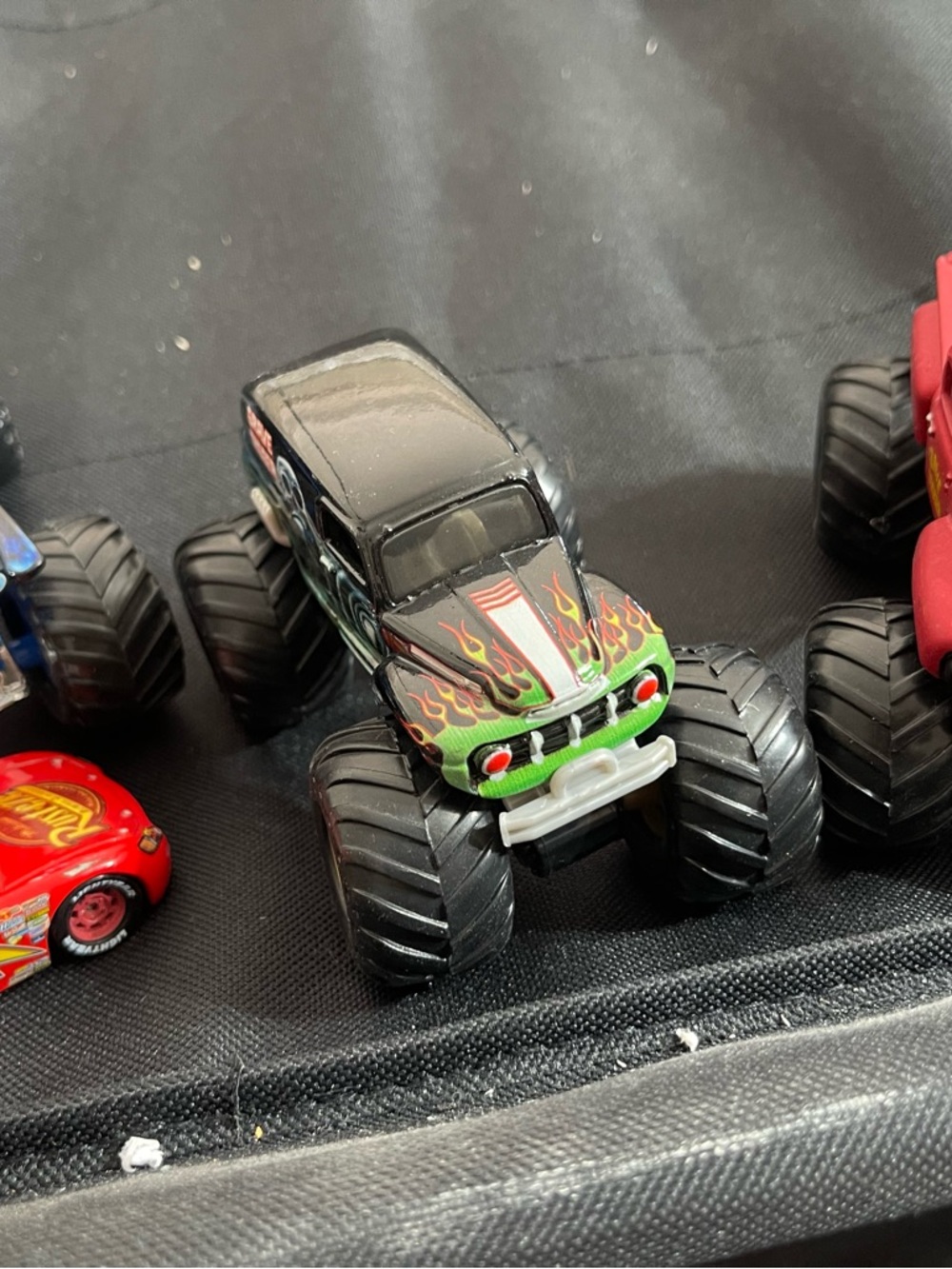 Lot 4. Black Monster Truck Toy with Green & Red Flame Details
